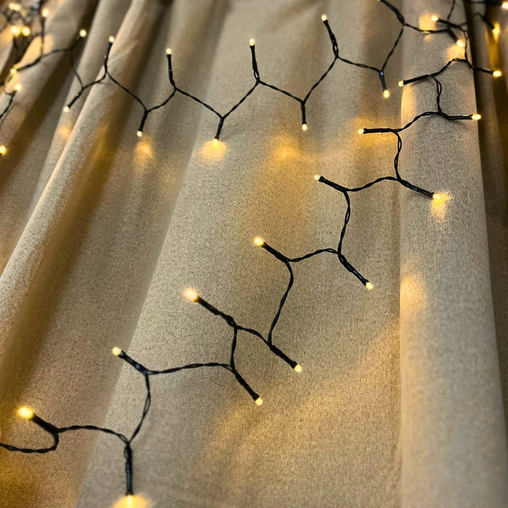 Dacore – Batteriebetriebene Lichterkette mit 120 LEDs, die im Takt der Musik blinkt – Warmweiß